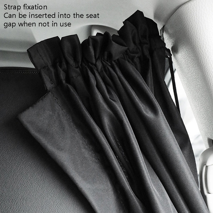 Black privacy curtain with strap detail and pleated fabric on car seat