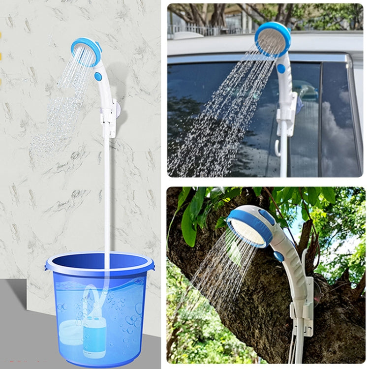 Blue electric pet shower head spraying water for outdoor car and plant cleaning
