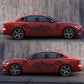 Black wolf totem decals on a red car door and rear quarter panel