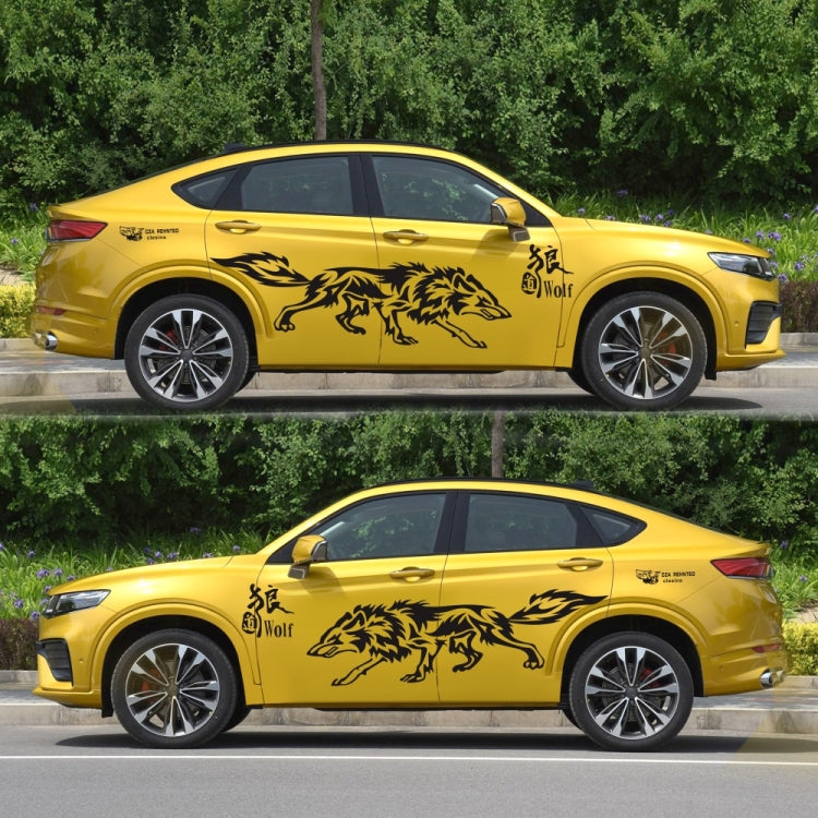 Black wolf totem decals on a yellow car door and rear quarter panel