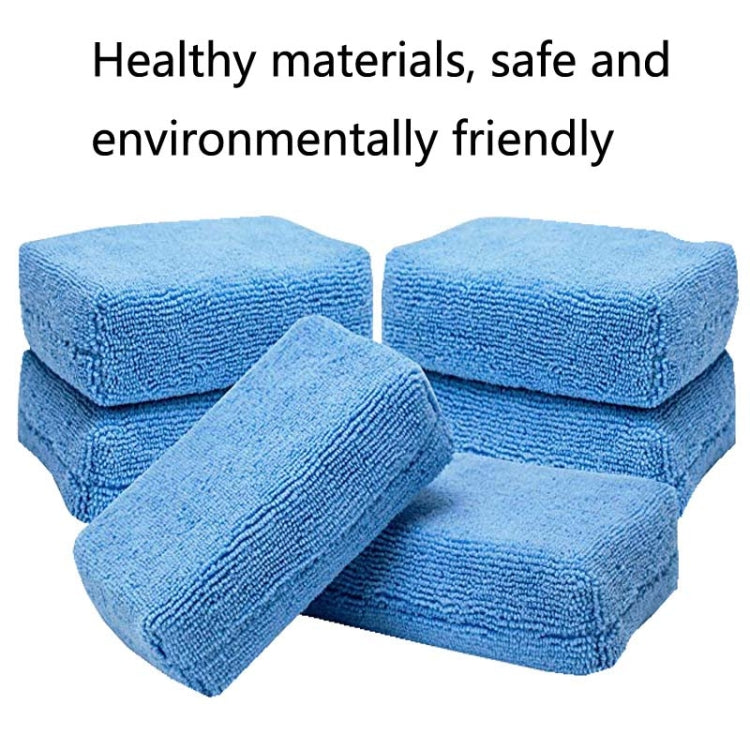 Set of blue microfiber sponge cloth pads, stacked and rolled for car care