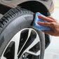 Blue microfiber cloth scrubbing car wheel tread