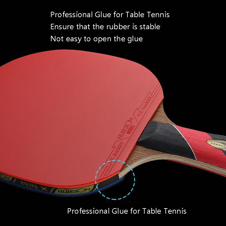 Close-up table tennis racket with red rubber face and wood blade edge detail