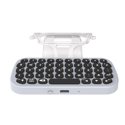 Wireless Bluetooth keyboard gamepad with keyboard stand open and black keys