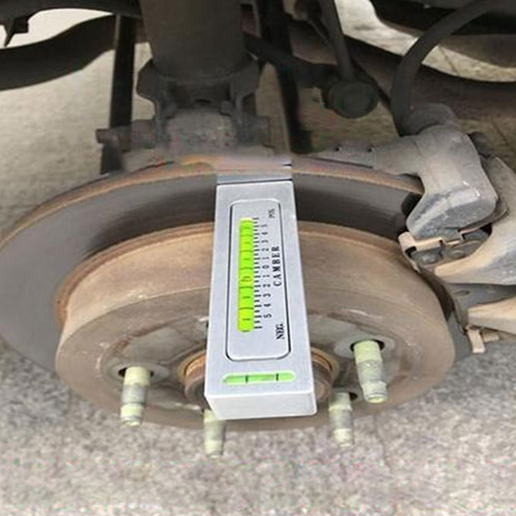 Camber adjustment level tool attached to car wheel for alignment measurement