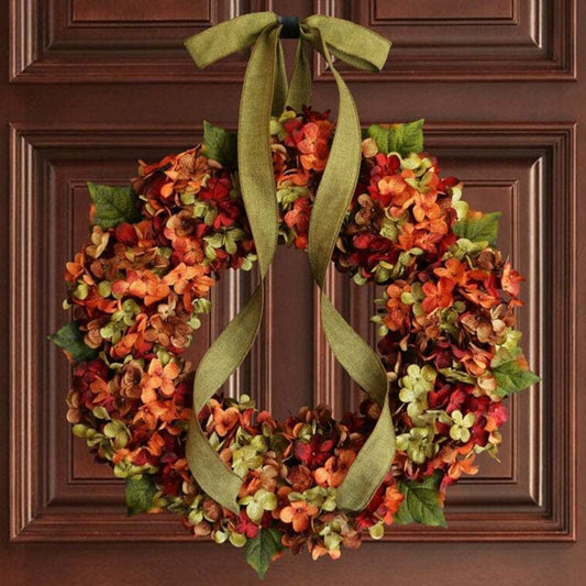 Artificial hydrangea flower wreath with green ribbon bow, orange and green blooms