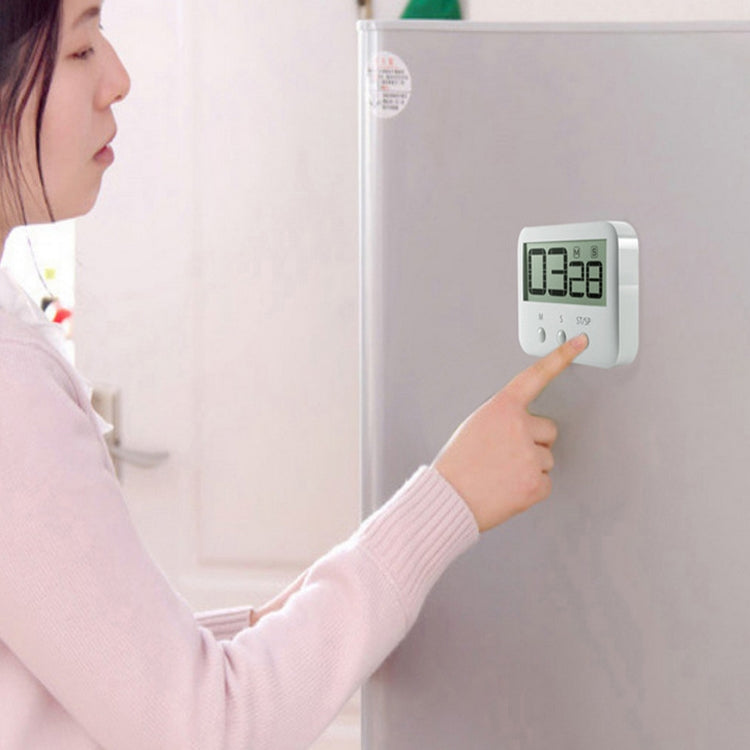 Wall-mounted LCD countdown timer with digital display and hand pressing buttons