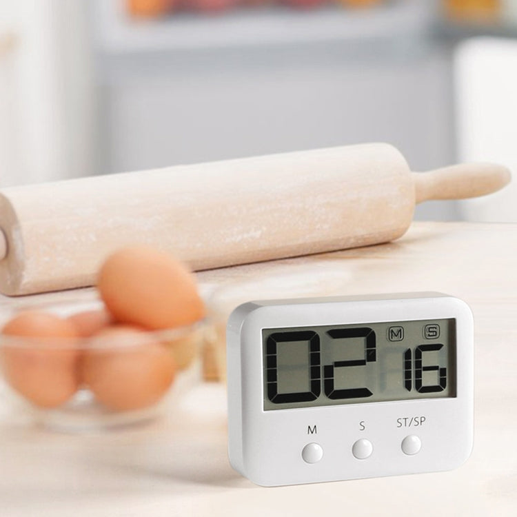 Close-up LCD countdown timer displaying digits with three control buttons