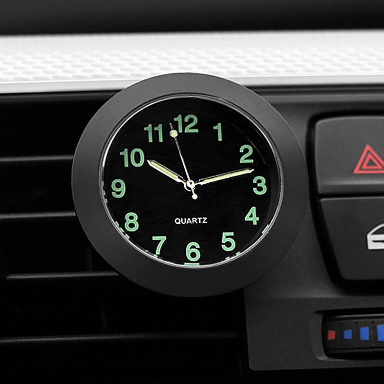 Car night light quartz clock with black face, silver ring, green glowing numbers