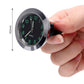 Car night light quartz clock being installed, black face with green illuminated numbers