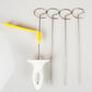 Potato spiral cutter set with yellow spiral blade, white base, four metal rods