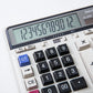Close-up of calculator LCD and large number buttons with white and blue keys