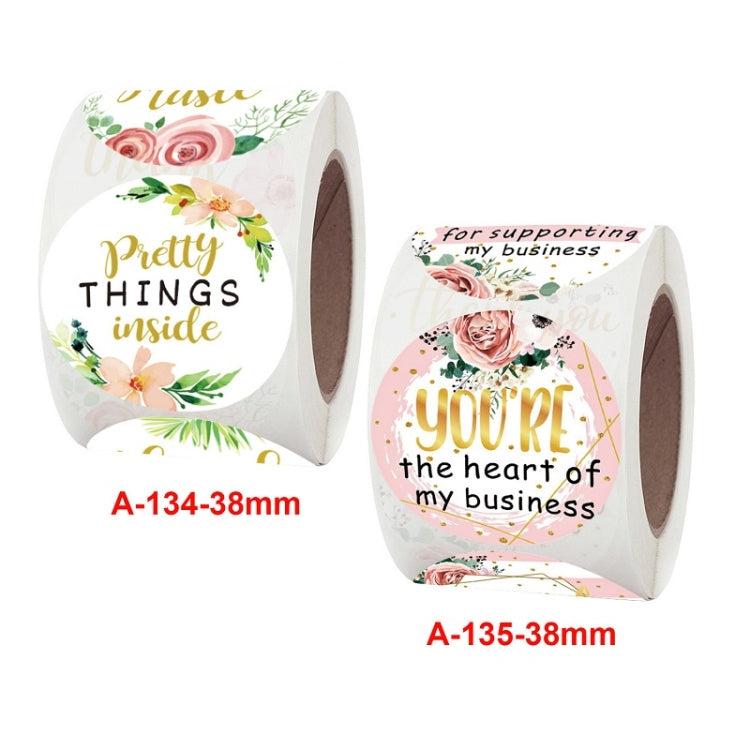 Floral thank-you sticker rolls, one reading 'Pretty things inside' and one with 'You'' heart text