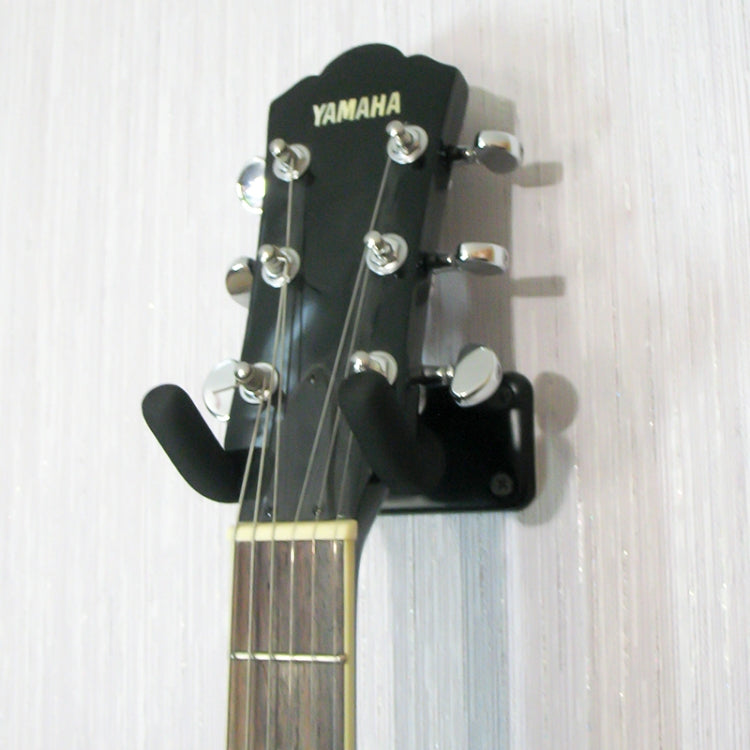Metal wall hook with black sponge U-shaped cradle holding a guitar head