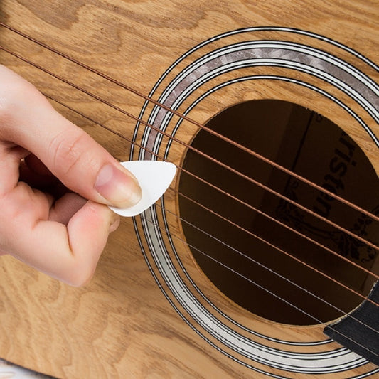 Guitar pick set, white triangular ABS pick held by fingers for strumming
