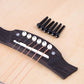 Black guitar string nails installed on guitar headstock strings