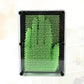 Green bead needle carving hand mold in clear square frame with black corner supports