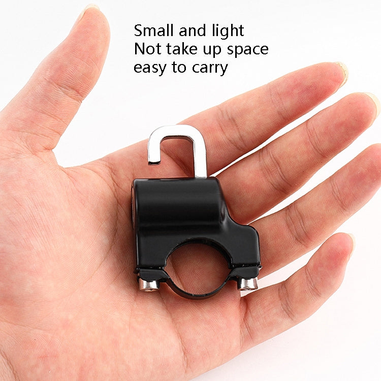 Black helmet lock in hand with silver shackle and circular lock body
