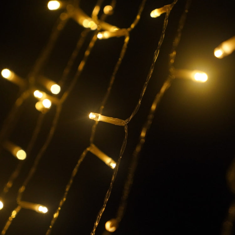 Close-up of warm LED strands for star waterfall lights with small bright bulbs along wires