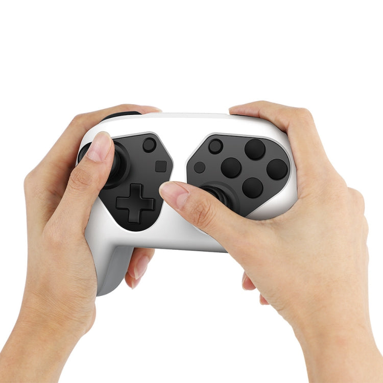 Hands fitting a white controller protection case over a gamepad