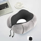 Gray U-shaped memory foam travel pillow with dark center fabric and adjustable cord