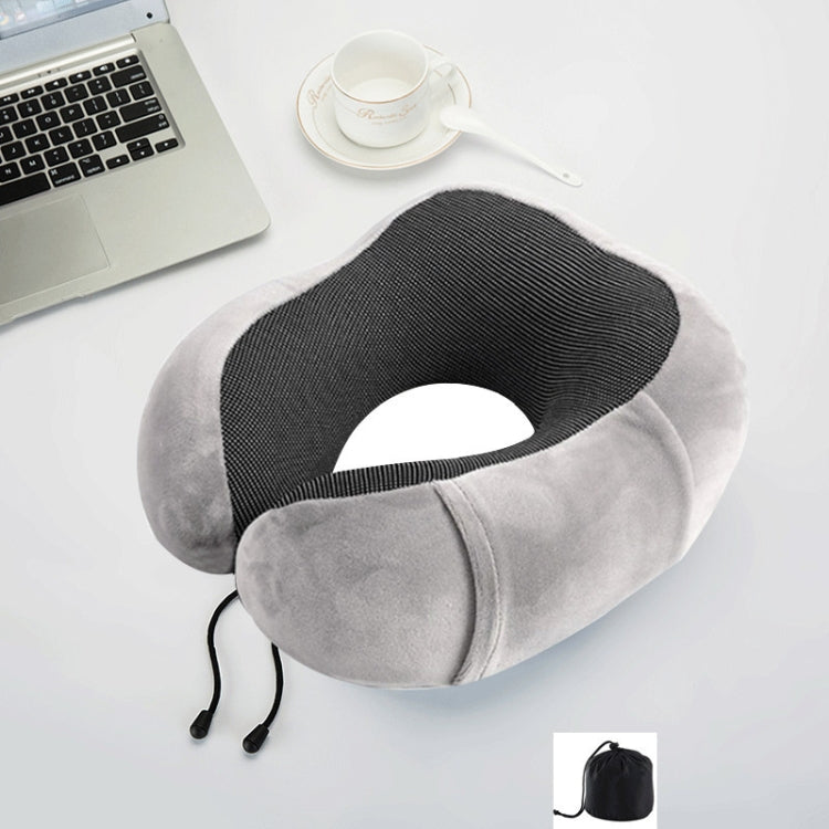 Gray U-shaped memory foam travel pillow with dark center fabric and adjustable cord
