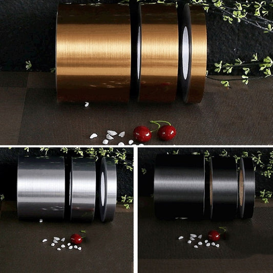 Decorative self-adhesive seam trim tape rolls in gold and dark brushed finishes