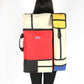 Multicolor portable sketchpad drawing bag back panel with shoulder strap and side handle.