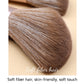Close-up of brown synthetic bristles on a lilac makeup brush head