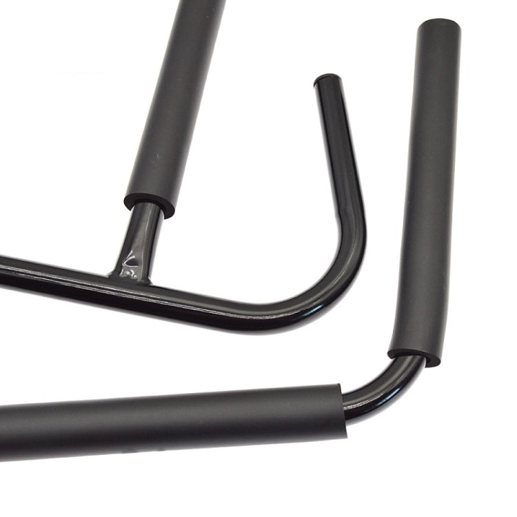 Black metal wall storage rack corner with curved U tubes and mounting posts