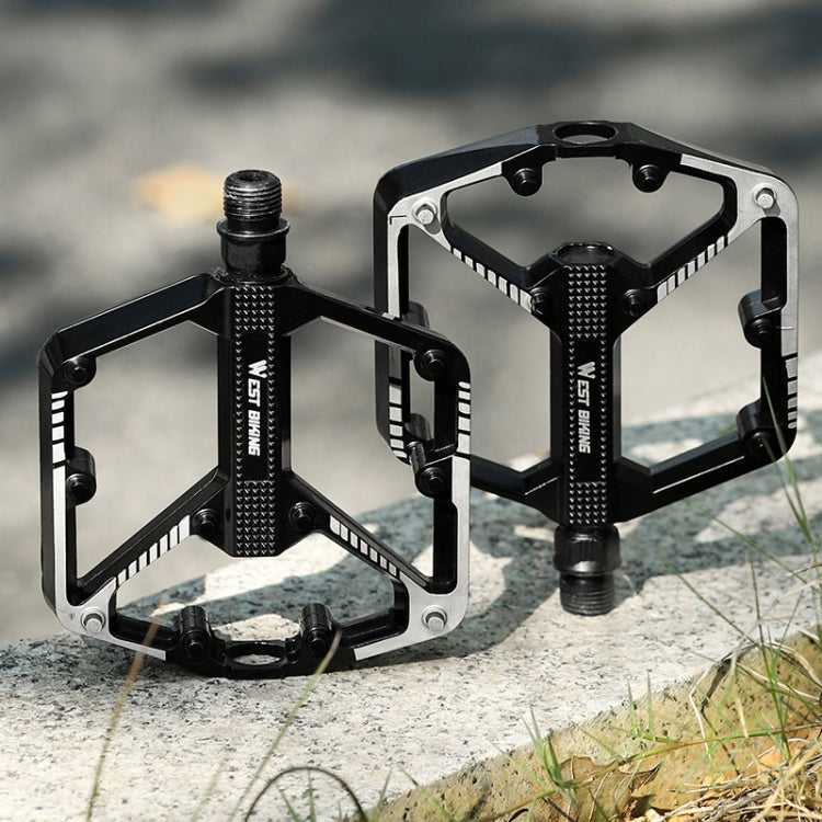 Bicycle platform pedals with black-and-silver metal frames and threaded axle posts