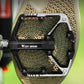 Bicycle platform pedal with metal pins and West BIKING logo, shown on shoe sole