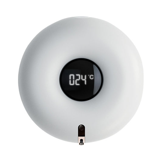 White wall-mounted soap dispenser with black circular display and outlet spout