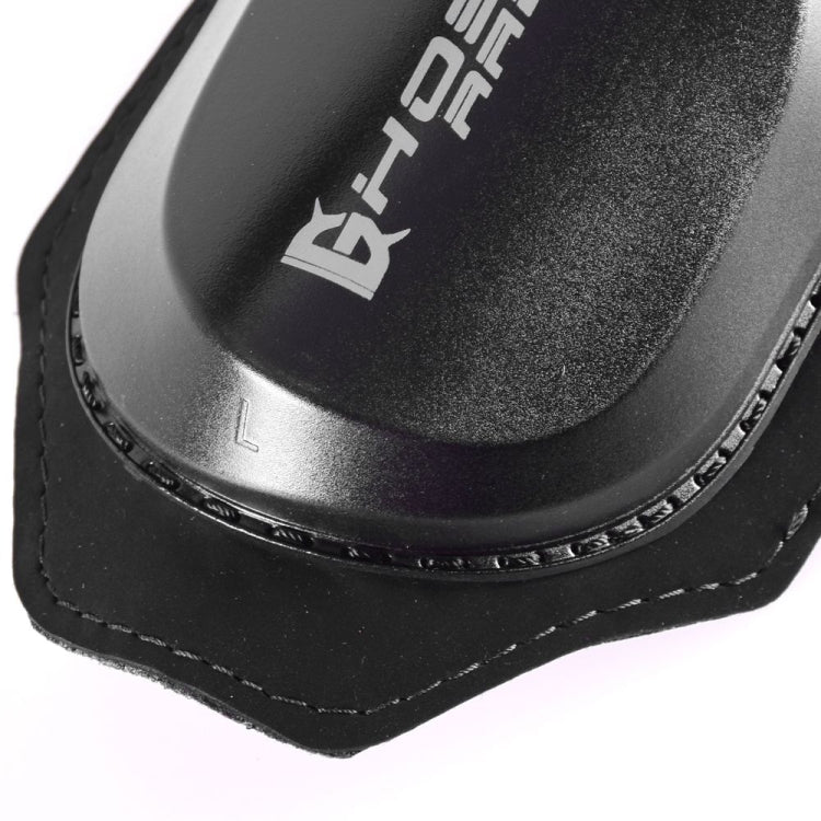 Close-up of black knee protector insert with textured outer shell and stitched edge