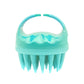 Teal silicone scalp hair washing brush with round handle and pointed bristles