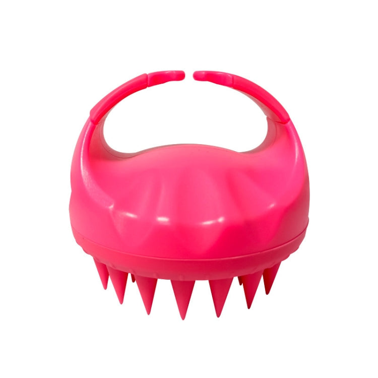 Hot pink silicone scalp hair washing brush with round handle and pointed bristles