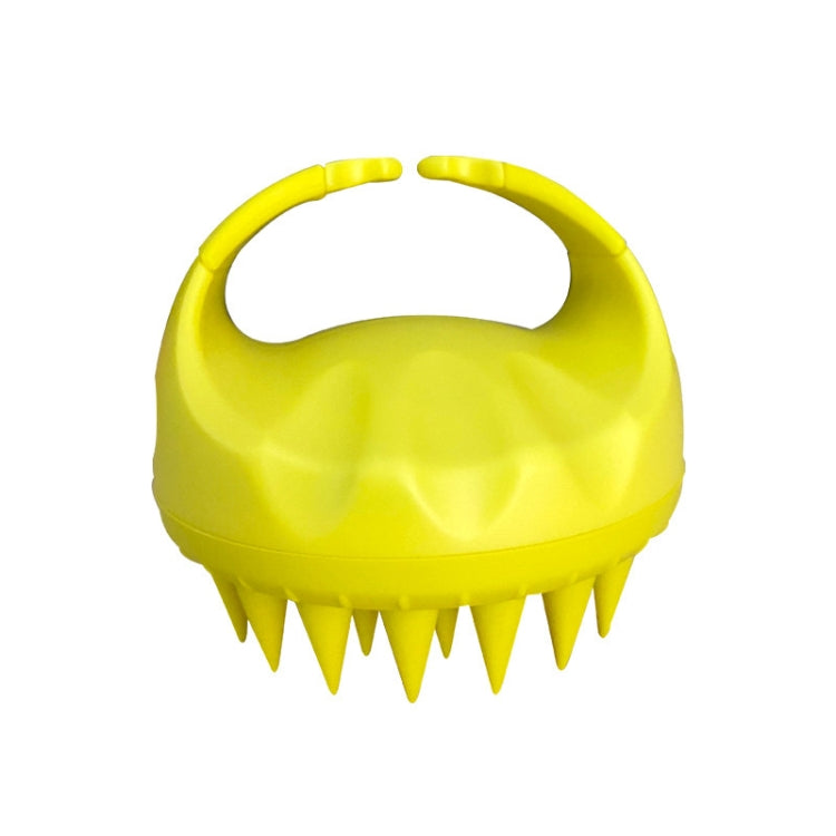 Yellow silicone scalp hair washing brush with round handle and pointed bristles