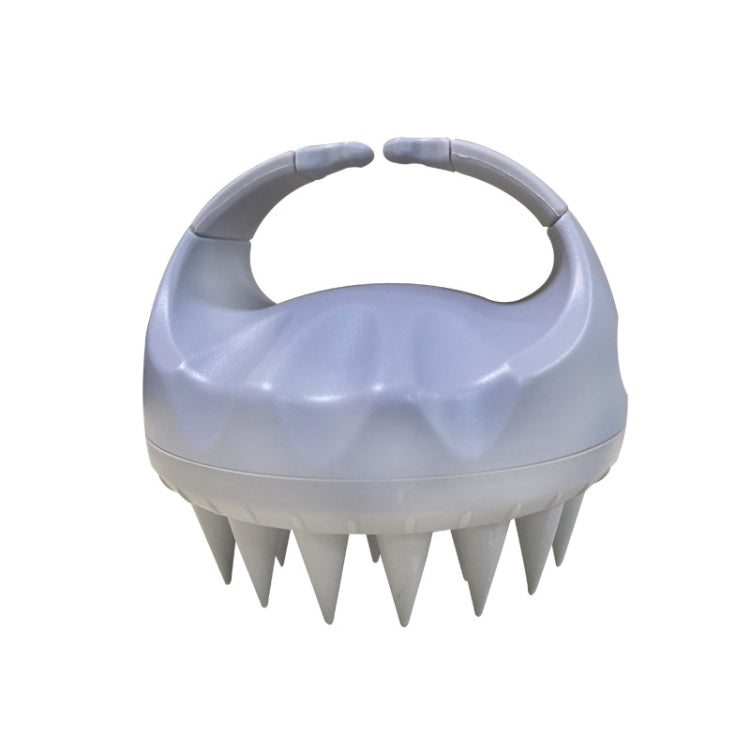 Light gray silicone scalp hair washing brush with round handle and pointed bristles
