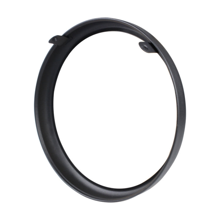 Black circular protective headlight housing ring with small tabs