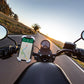 Phone navigation holder mounted on motorcycle handlebars, portrait phone displayed