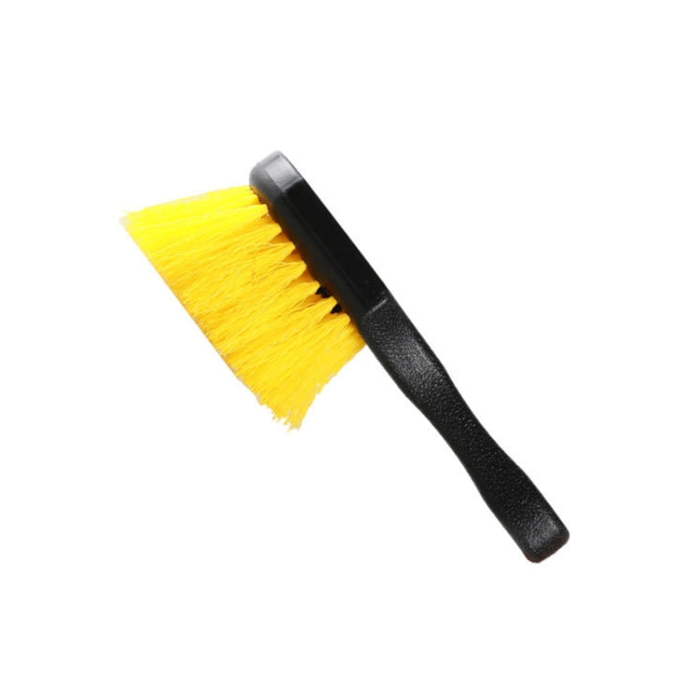 Short-handled tire cleaning brush with yellow long bristles and black grip