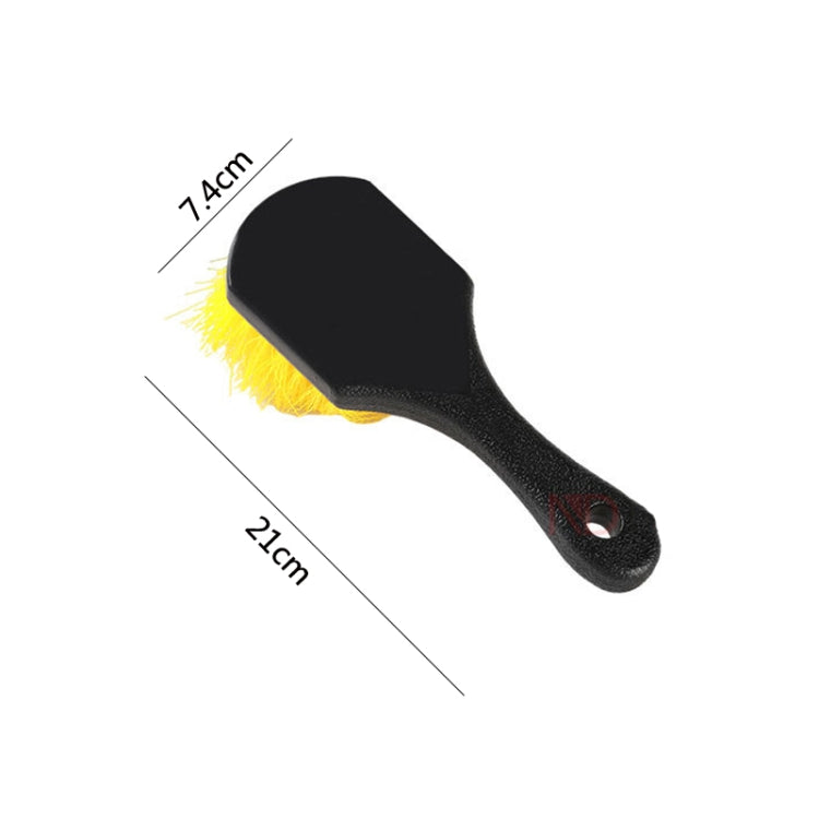 Short tire brush with curved black head, yellow bristles, and hanging hole