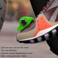 Green motorcycle gear shift cover on a shoe area