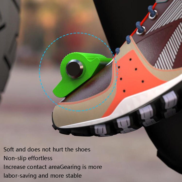 Green motorcycle gear shift cover on a shoe area