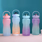 Set of sports water bottles with straw lids and carry handles in pastel colors