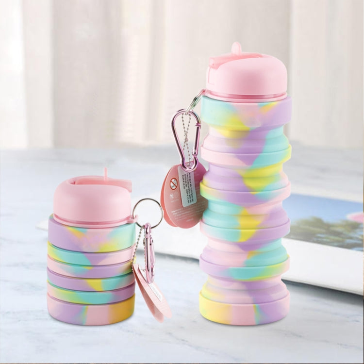 Portable collapsible water cup with pink lid, pastel rainbow folds, hanging carabiner