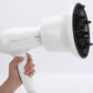 White hair diffuser attachment with black vented face, held for attachment to dryer