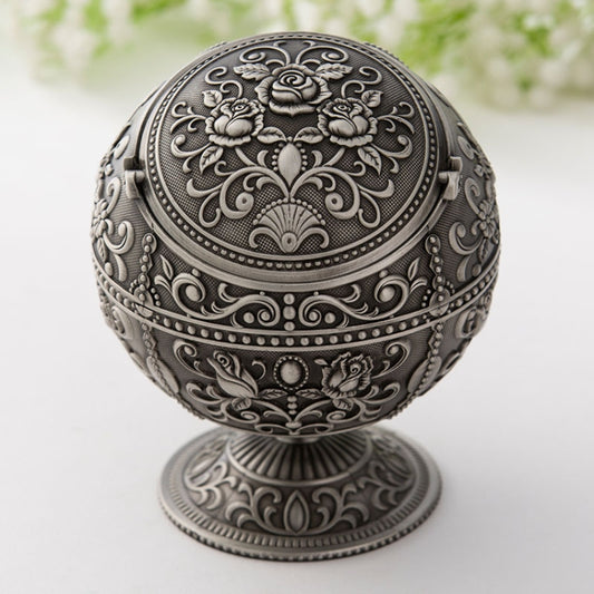 Decorative metal ashtray with hinged lid, dark silver with floral engraving