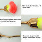 Loose powder makeup brush with multicolor bristles and gold petal-shaped tube