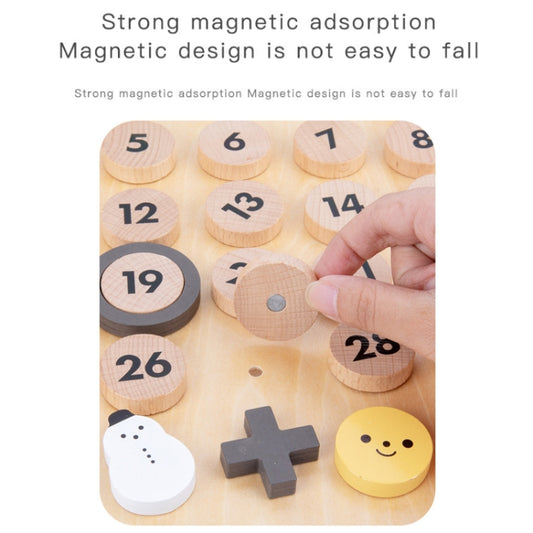 Children's wooden perpetual calendar with hand holding a magnetic date disc and icons